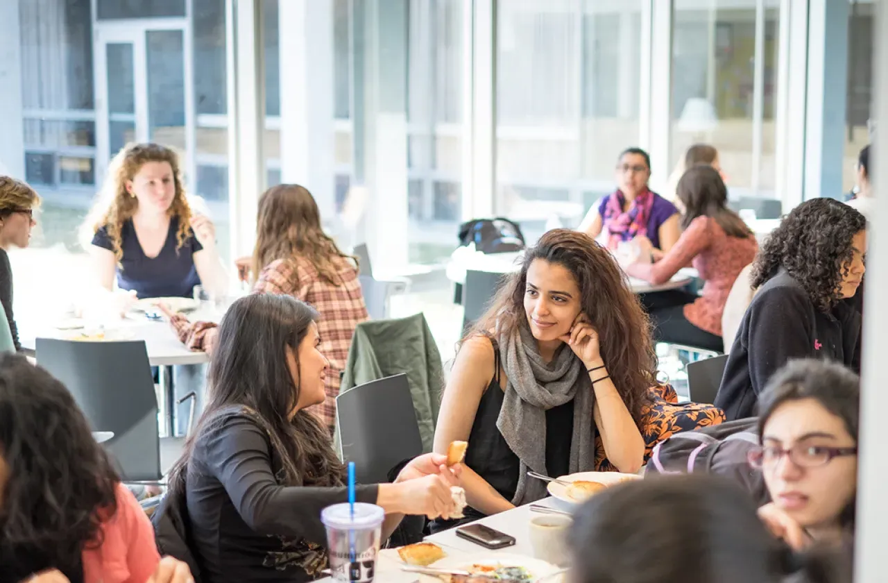 Two students chatting in the Cutter-Ziskind dining room